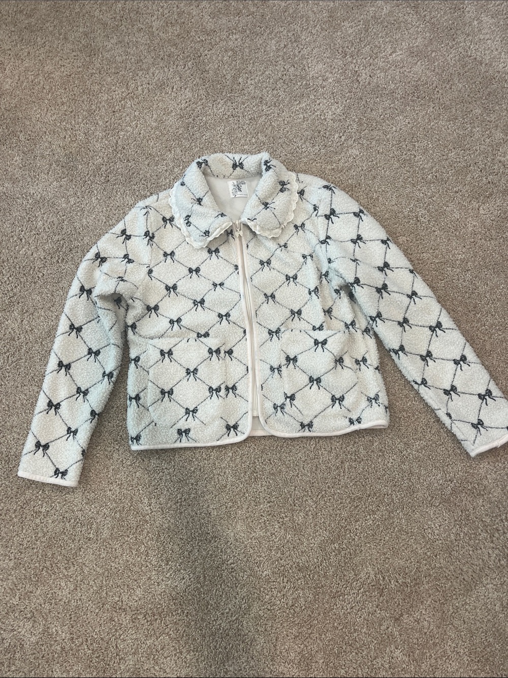 Altar'd State Ivory Sherpa Jacket with Black Bow Pattern